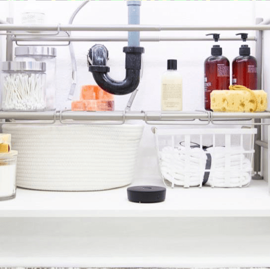 Leak sensor deployed under a kitchen sink